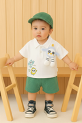 Child in outfit with all green elements